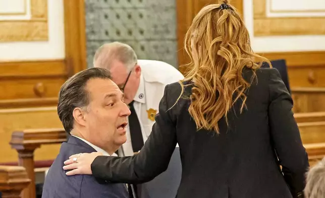 Defendant Brian Walshe, left, chats with his lawyer Kelli Porges during his murder trial, Friday, Dec. 12, 2025, in Dedham, Mass. (Stuart Cahill/The Boston Herald via AP, Pool)