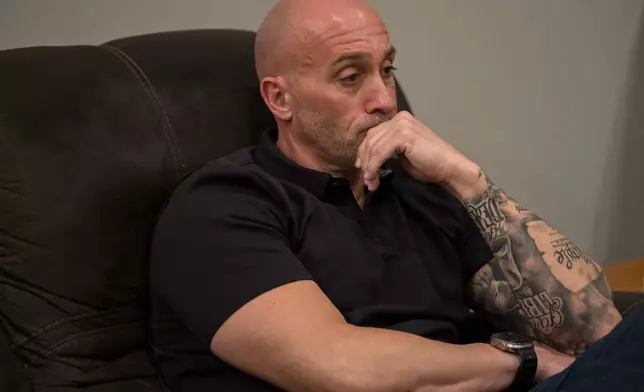 Joseph "Tucker" Daniels listens to lawyers at his home in Thibodaux, La., Thursday, Nov. 13, 2025. (AP Photo/Matthew Hinton)