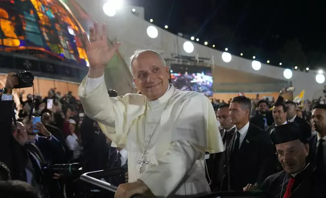 Pope Leo XIV arrives for a meeting with young people in the Square in front of the Maronite Patriarchate of Antioch in Bkerke, Lebanon, Monday, Dec. 1, 2025. (AP Photo/Domenico Stinellis)