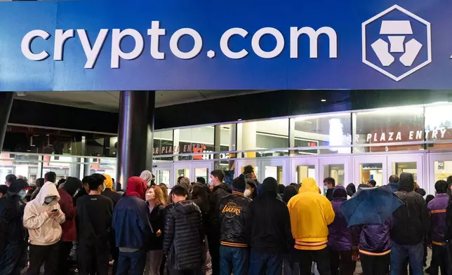 FILE - A Crypto.com Arena sign hangs outside Staples Center before an NBA basketball game in Los Angeles, Dec. 23, 2021. (AP Photo/Jae C. Hong, File)