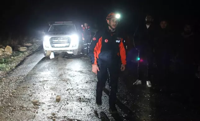 Turkish rescue teams search for the remains of a private jet carrying Libya's military chief and four others that crashed after taking off from Ankara, killing everyone on board, in Ankara, Turkey, Tuesday, Dec. 23, 2025. (AP Photo/Efekan Akyuz)