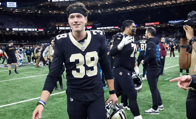 New Orleans Saints placekicker Charlie Smyth (39) runs off the field after an NFL football game against the Carolina Panthers, Sunday, Dec. 14, 2025, in New Orleans. (AP Photo/Butch Dill)