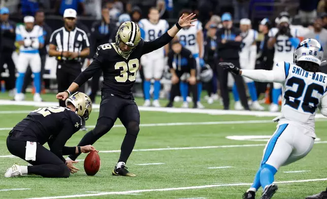 New Orleans Saints placekicker Charlie Smyth (39) kicks a field goal to win the game in the second half of an NFL football game against the Carolina Panthers, Sunday, Dec. 14, 2025, in New Orleans. (AP Photo/Butch Dill)
