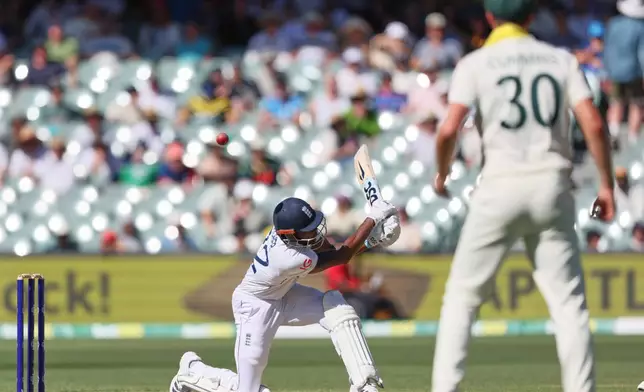 England's Jofra Archer plays a shot during play on day two of the third Ashes cricket test between England and Australia in Adelaide, Australia, Thursday, Dec. 18, 2025. (AP Photo/James Elsby)