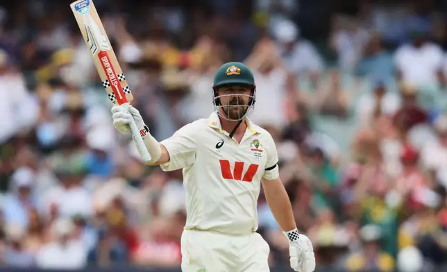 Australia's Travis Head reacts after scoring 50 runs during play on day three of the third Ashes cricket test between England and Australia in Adelaide, Australia, Friday, Dec. 19, 2025. (AP Photo/James Elsby)