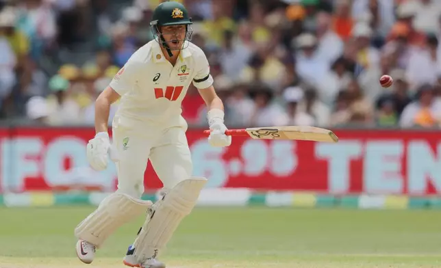 Australia's Marnus Labuschagne reacts while batting during play on day three of the third Ashes cricket test between England and Australia in Adelaide, Australia, Friday, Dec. 19, 2025. (AP Photo/James Elsby)