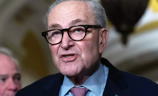 Senate Minority Leader Chuck Schumer, D-N.Y., speaks to reporters following the weekly policy luncheons at the Capitol, Tuesday, Dec. 16, 2025, in Washington. (AP Photo/Jose Luis Magana)