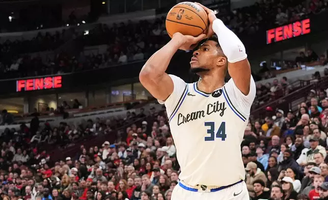 Milwaukee Bucks forward Giannis Antetokounmpo shoots against the Chicago Bulls during the first half of an NBA basketball game in Chicago, Saturday, Dec. 27, 2025. (AP Photo/Nam Y. Huh)