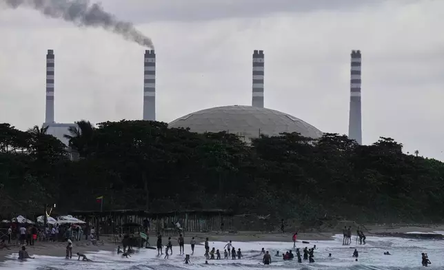 The El Palito refinery rises above a beach in Puerto Cabello, Venezuela, Sunday, Dec. 21, 2025. (AP Photo/Matias Delacroix)