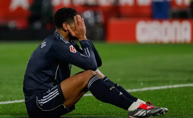 Real Madrid's Jude Bellingham reacts during a Spanish La Liga soccer match between Girona and Real Madrid, in Girona, Spain, Sunday, Nov. 30, 2025. (AP Photo/Joan Monfort)