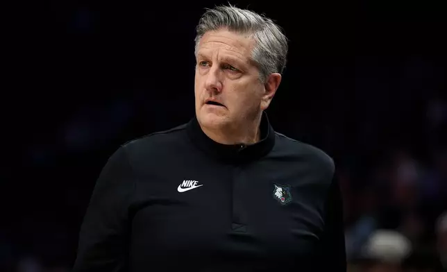 Minnesota Timberwolves head coach Chris Finch looks on during the first half of an NBA basketball game against the Sacramento Kings, Sunday, Dec. 14, 2025, in Minneapolis. (AP Photo/Matt Krohn)