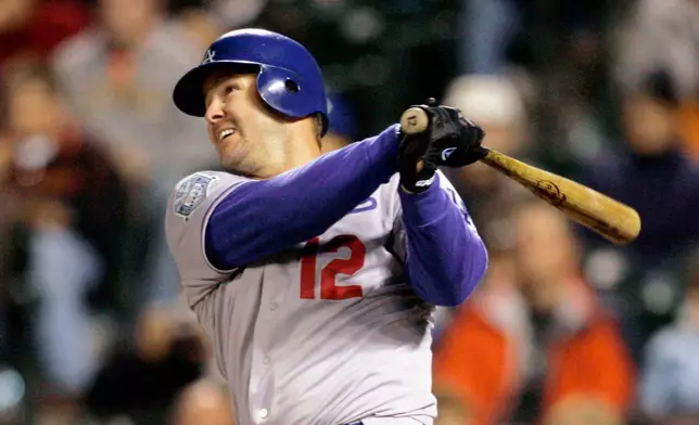 FILE - Los Angeles Dodgers Jeff Kent hits a two-run home run against the San Francisco Giants in the fourth inning of a baseball game in San Francisco, Sept. 26, 2008. (AP Photo/Jeff Chiu, File)