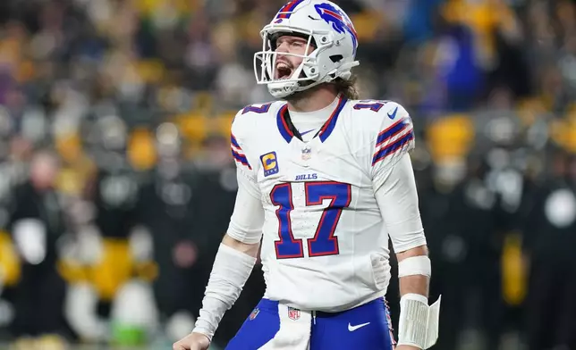 Buffalo Bills quarterback Josh Allen (17) celebrates after a touchdown during the second half of an NFL football game against the Pittsburgh Steelers Sunday, Nov. 30, 2025, in Pittsburgh. (AP Photo/Matt Freed)
