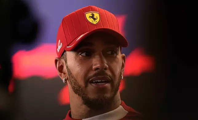 Ferrari driver Lewis Hamilton of Britain reacts after the Formula One Abu Dhabi Grand Prix at the Yas Marina Circuit in Abu Dhabi, UAE, Sunday, Dec. 7, 2025. (AP Photo/Fatima Shbair)