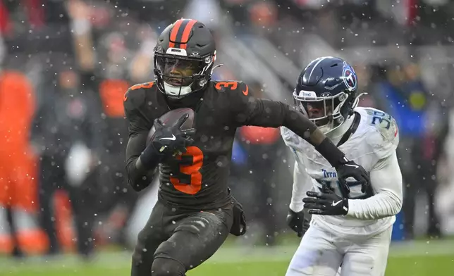 Cleveland Browns wide receiver Jerry Jeudy (3) sprints to the end zone after catching a touchdown pass as Tennessee Titans cornerback Darrell Baker Jr. (39) gives chase in the first half of an NFL football game in Cleveland, Sunday, Dec. 7, 2025. (AP Photo/David Richard)
