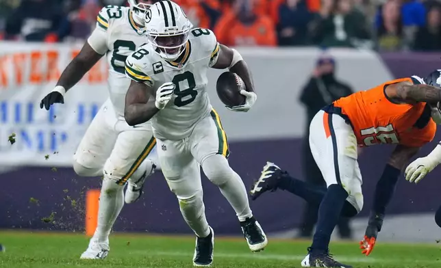 Green Bay Packers' Josh Jacobs runs during the second half of an NFL football game against the Denver Broncos Sunday, Dec. 14, 2025, in Denver. (AP Photo/Jack Dempsey)