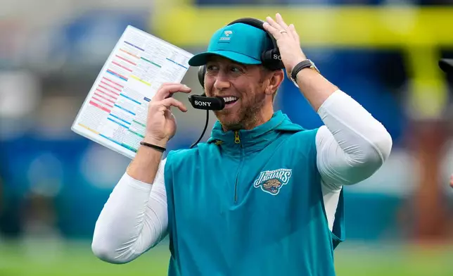 Jacksonville Jaguars head coach Liam Coen on the sideline during the first half of an NFL football game against the Indianapolis Colts, Sunday, Dec. 7, 2025, in Jacksonville, Fla. (AP Photo/John Raoux)
