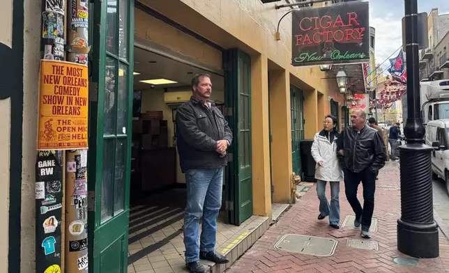 Buck Harley, a cigar shop manager, stands outside of his store Monday, Dec. 29, 2025, on Bourbon Street in New Orleans. (AP Photo/Jack Brook)