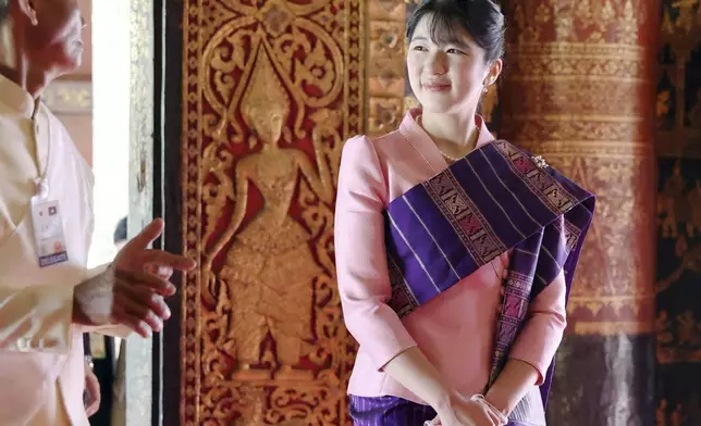 FILE - Princess Aiko, the daughter of Japan's Emperor Naruhito and Empress Masako visits the Wat Xieng Thong Buddhist Temple in Luang Prabang, Laos, Thursday, Nov. 20, 2025. (Japan Pool/Kyodo News via AP, File)