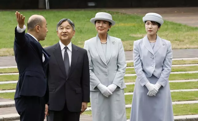 FILE - Japanese Emperor Naruhito, center left, Empress Masako center right, and Princess Aiko, right, listen to Nagasaki Mayor Shiro Suzuki, left, as they visit the cenotaph for the atomic bombing victims at the peace park in Nagasaki. western Japan, Friday, Sept. 12, 2025. (Kyodo News via AP, File)