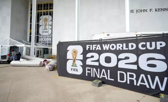 The red carpet is delivered prior to the final draw for the 2026 soccer World Cup at the Kennedy Center in Washington, Thursday, Dec. 4, 2025. (AP Photo/Chris Carlson)