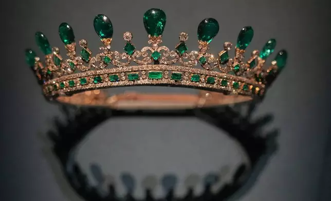The Queen Victoria's emerald tiara, designed by Prince Albert and crafted by Joseph Kitching, London, 1845, emeralds and diamonds set in gold and silver.displayed at the exhibition "Dynastic Jewels" organized by The Al Thani Collection Foundation at the Hôtel de la Marine museum in Paris, France, Monday, Dec. 8, 2025. (AP Photo/Michel Euler)