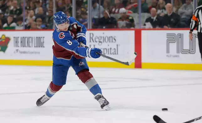 Colorado Avalanche defenseman Cale Makar scores during the second period of an NHL hockey game against the Minnesota Wild, Sunday, Dec. 21, 2025, in St. Paul, Minn. (AP Photo/Bailey Hillesheim)