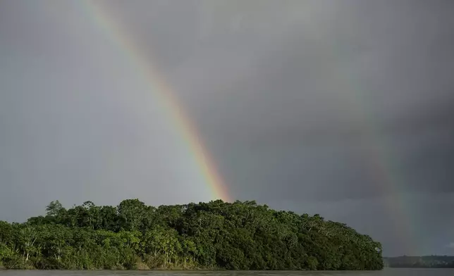 Rainbows cross the Putumayo River on the outskirts of Puerto Asis, Colombia, Wednesday, Nov. 26, 2025. (AP Photo/Ivan Valencia)