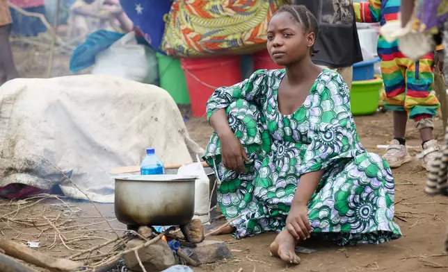 Internally displaced people (IDPs) who fled fighting in Congo's South Kivu province prepare a meal in Cibitoke, Kansega, Burundi, Thursday, Dec. 11, 2025. (AP Photo/Berthier Mugiraneza)