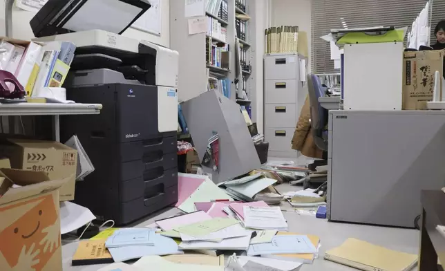 Papers are scattered on the floor at an office in Hakodate, Hokkaido, northern Japan Tuesday, Dec. 9, 2025, following a powerful earthquake on late Monday. (Kyodo News via AP)