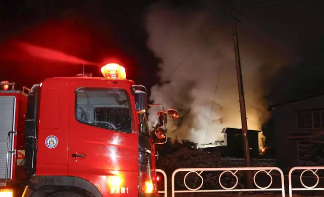 Smoke rises from the site of a fire in Aomori, northern Japan Tuesday, Dec. 9, 2025, following a powerful earthquake on late Monday. (Kyodo News via AP)
