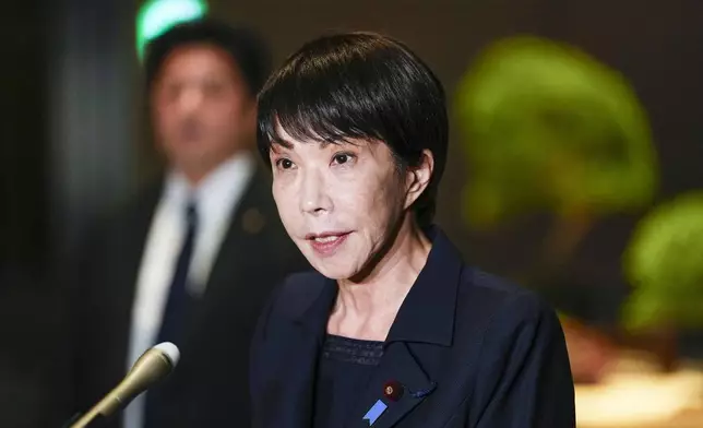 Japan's Prime Minister Sanae Takaichi speaks to reporters at the prime minister's office in Tokyo after a strong earthquake struck northeastern Japan. (Kyodo News via AP)