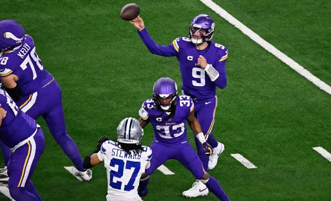 Minnesota Vikings quarterback J.J. McCarthy (9) throws a pass during the first half of an NFL football game against the Dallas Cowboys Sunday, Dec. 14, 2025, in Arlington, Texas. (AP Photo/Jerome Miron)