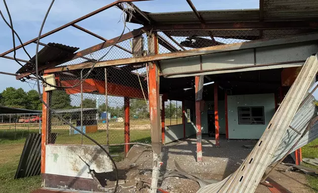 A house is seen damaged by Cambodian artillery fire in Sisaket province, Thailand, Tuesday, Dec. 9, 2025. (AP Photo/Wason Wanichakorn)