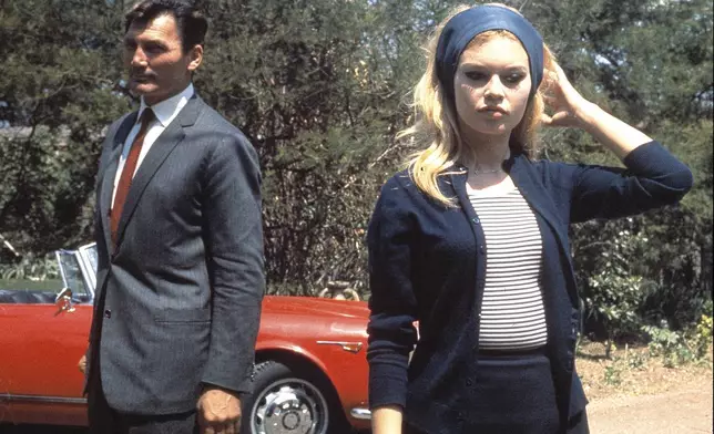 FILE - French actress Brigitte Bardot with actor Jack Palance during filming of the movie "Le Mepris" aka "Contempt", by Jean-Luc Godard, in Rome, Italy, May 1963. (AP Photo/File)