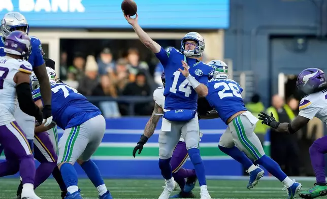 Seattle Seahawks quarterback Sam Darnold (14) passes against the Minnesota Vikings during the second half of an NFL football game, Sunday, Nov. 30, 2025, in Seattle. (AP Photo/Lindsey Wasson)