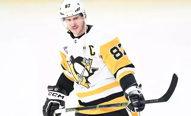 Pittsburgh Penguins' Sidney Crosby skates prior to an NHL hockey game against the Montreal Canadiens in Montreal, Saturday, Dec. 20, 2025. (Graham Hughes/The Canadian Press via AP)