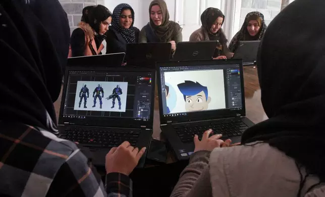 FILE - Afghan coders practice at the Code to Inspire computer training center in Herat province, western Afghanistan, Jan. 22, 2018. (AP Photo/Ahmad Seir, File)