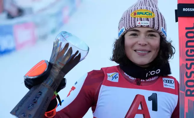 Austria's Julia Scheib celebrates winning an alpine ski, women's World Cup giant slalom, in Semmering, Austria, Saturday, Dec. 27, 2025. (AP Photo/Giovanni Auletta)