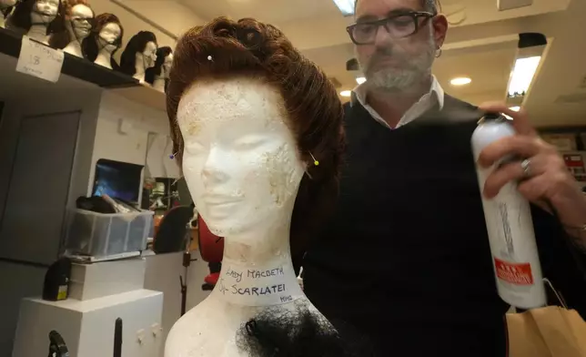 A wig receives final touches ahead of the dress rehearsal of Dmitri Shostakovich's Lady Macbeth of the Mtsensk District at La Scala Opera House in Milan, Italy, Thursday, Dec. 4, 2025. (AP Photo/Antonio Calanni)