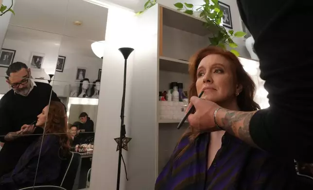Soprano Sara Jakubiak has her makeup done ahead of the dress rehearsal of Dmitri Shostakovich's Lady Macbeth of the Mtsensk District at La Scala Opera House in Milan, Italy, Thursday, Dec. 4, 2025. (AP Photo/Antonio Calanni)