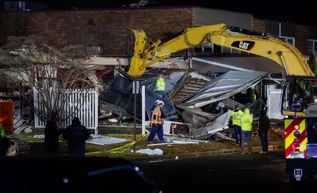 First responders work at the scene of an explosion and fire at Bristol Health &amp; Rehab Center, Tuesday, Dec. 23, 2025, in Bristol, Pa. (Monica Herndon/The Philadelphia Inquirer via AP)