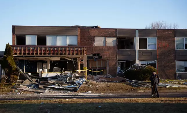Investigators work around Bristol Health &amp; Rehab Center and surrounding rubble after a gas explosion the day prior on Wednesday, Dec. 24, 2025, in Bristol, Pa. (AP Photo/Mingson Lau)