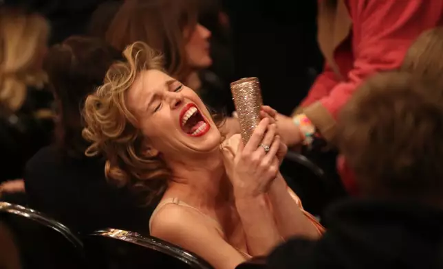 FILE - Model Eva Herzigova laughs as she attends the final Jean Paul Gaultier Haute Couture Spring/Summer 2020 fashion collection presented on Jan. 22, 2020, in Paris. (AP Photo/Thibault Camus, File)