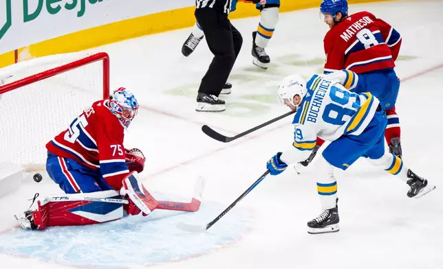 St. Louis Blues' Pavel Buchnevich (89) scores against Montreal Canadiens goaltender Jakub Dobes (75) while Canadiens' Mike Matheson (8) defends during second-period NHL hockey game action in Montreal, Sunday, Dec. 7, 2025. (Christopher Katsarov/The Canadian Press via AP)