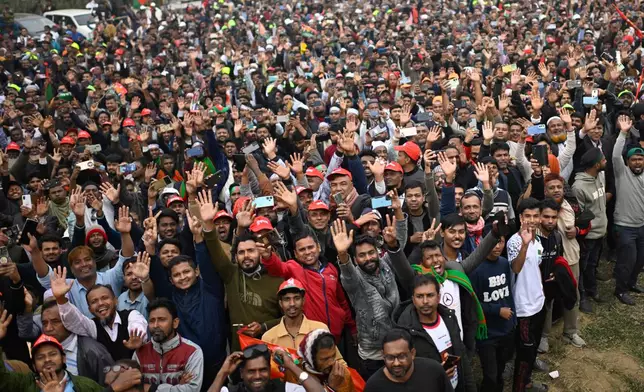 Supporters of Bangladesh Nationalist Party (BNP) Acting Chairman Tarique Rahman shout slogans following his arrival at Hazrat Shahjalal International Airport in Dhaka after more than 17 years of self-imposed exile in London, Thursday, Dec. 25, 2025. (AP Photo/ Mahmud Hossain Opu)