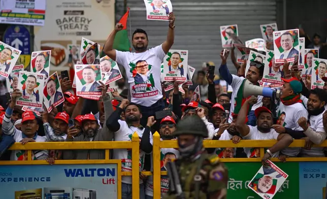 Supporters of Bangladesh Nationalist Party (BNP) Acting Chairman Tarique Rahman shout slogans following his arrival at Hazrat Shahjalal International Airport in Dhaka after more than 17 years of self-imposed exile in London, Thursday, Dec. 25, 2025. (AP Photo/ Mahmud Hossain Opu)