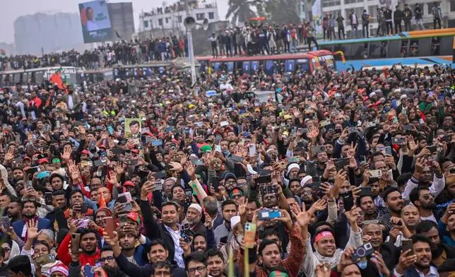 Supporters of Bangladesh Nationalist Party (BNP) Acting Chairman Tarique Rahman shout slogans following his arrival at Hazrat Shahjalal International Airport in Dhaka after more than 17 years of self-imposed exile in London, Thursday, Dec. 25, 2025. (AP Photo/ Mahmud Hossain Opu)