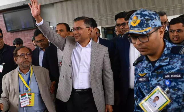 Bangladesh Nationalist Party (BNP) Acting Chairman, Tarique Rahman, waves to supporters at Hazrat Shahjalal International Airport in Dhaka after returning from London, ending more than 17 years of self-imposed exile, Thursday, Dec. 25, 2025. (AP Photo/Mahmud Hossain Opu)