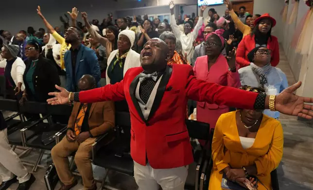 FILE - Jean-Michel Gisnel cries out while praying with other congregants at the First Haitian Evangelical Church of Springfield, Sunday, Jan. 26, 2025, in Springfield, Ohio. (AP Photo/Luis Andres Henao, File)